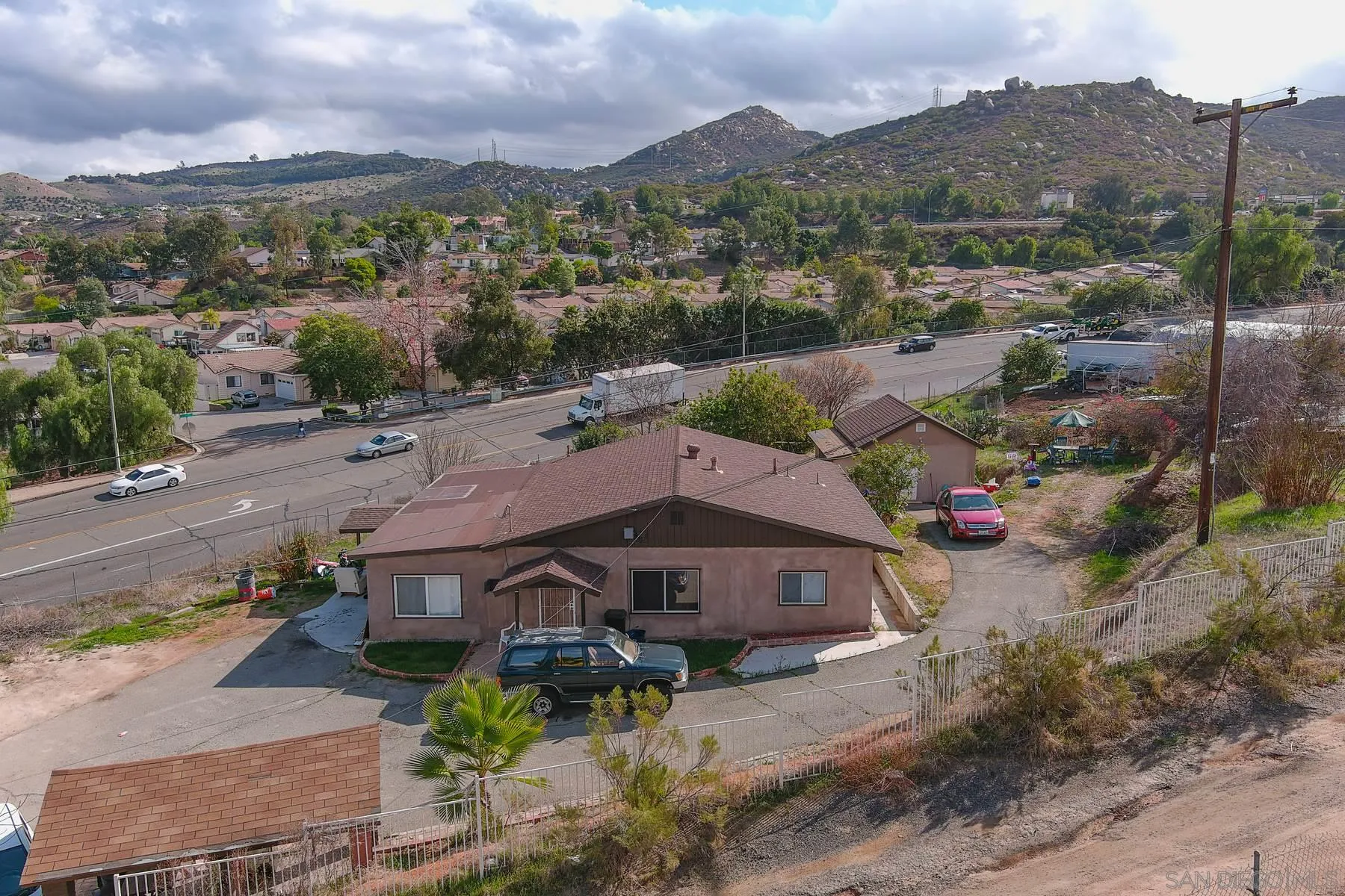 8443 Holsofar Road El Cajon, CA 92021 - Photo 9 of 11 an aerial view of a house with a garden