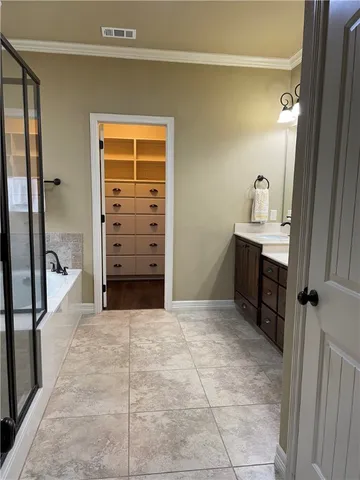 a view of a hallway to rooms