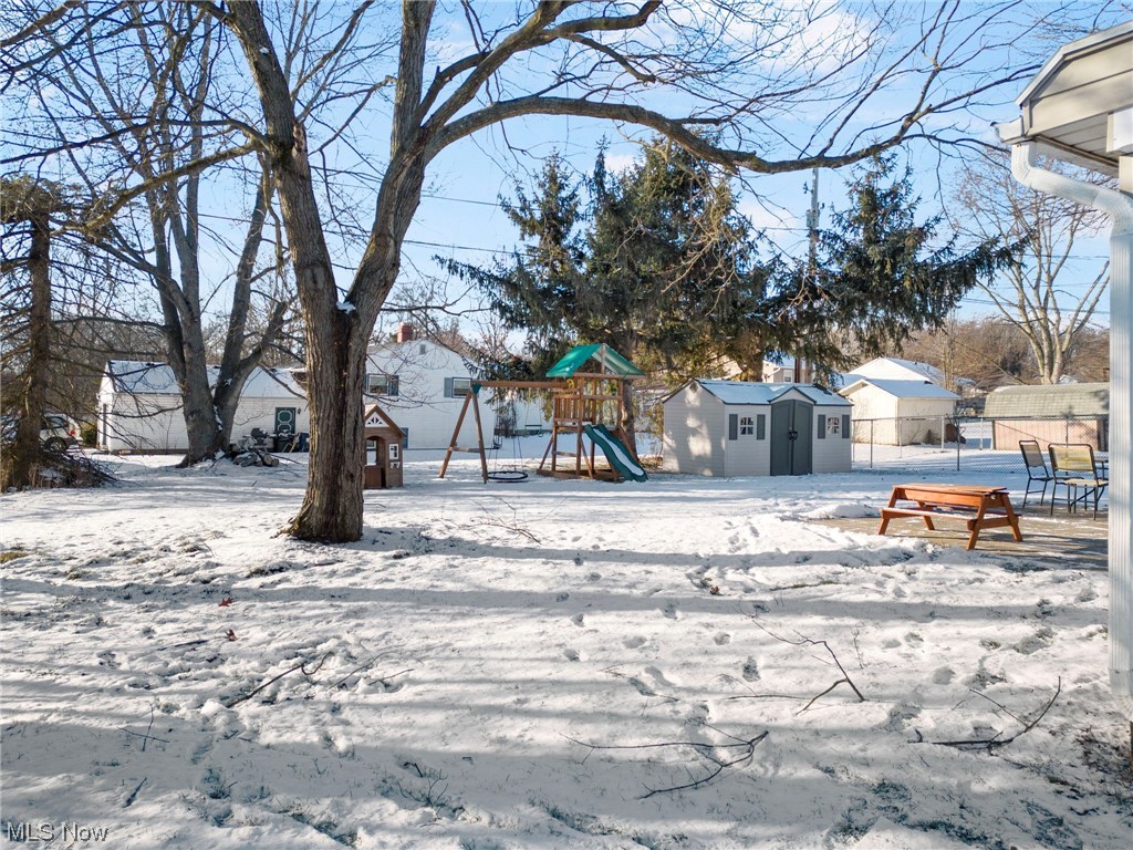 801 Netherwood Avenue Northwest Canton, OH 44708 - Photo 33 of 44 Level Yard with a shed and a playground set to convey
