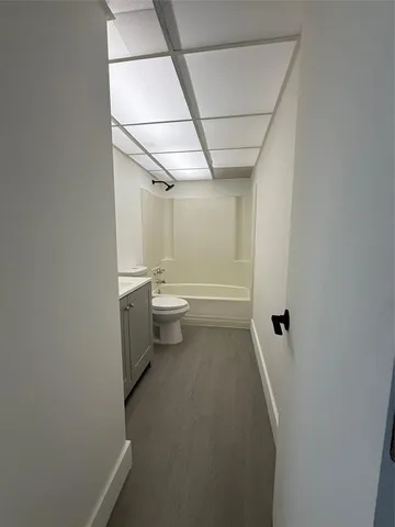 a bathroom with a toilet a sink and bathtub