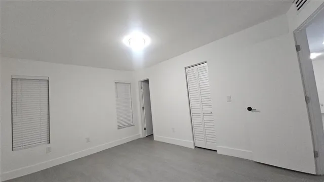 an empty room with a hallway