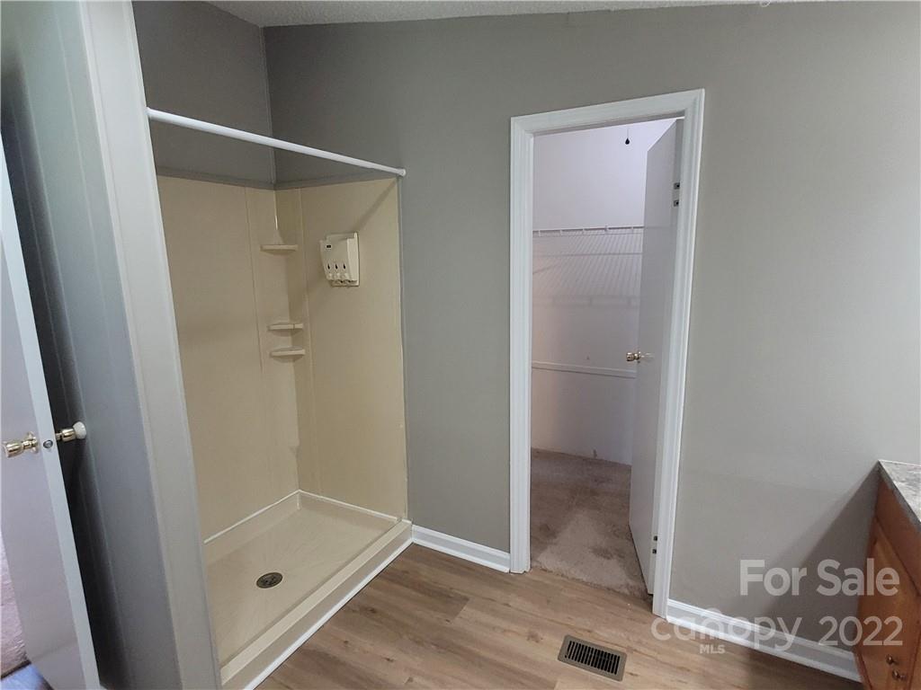 309 Johnson Dairy Road Mooresville, NC 28115 - Photo 11 of 19 a bathroom with a glass shower door