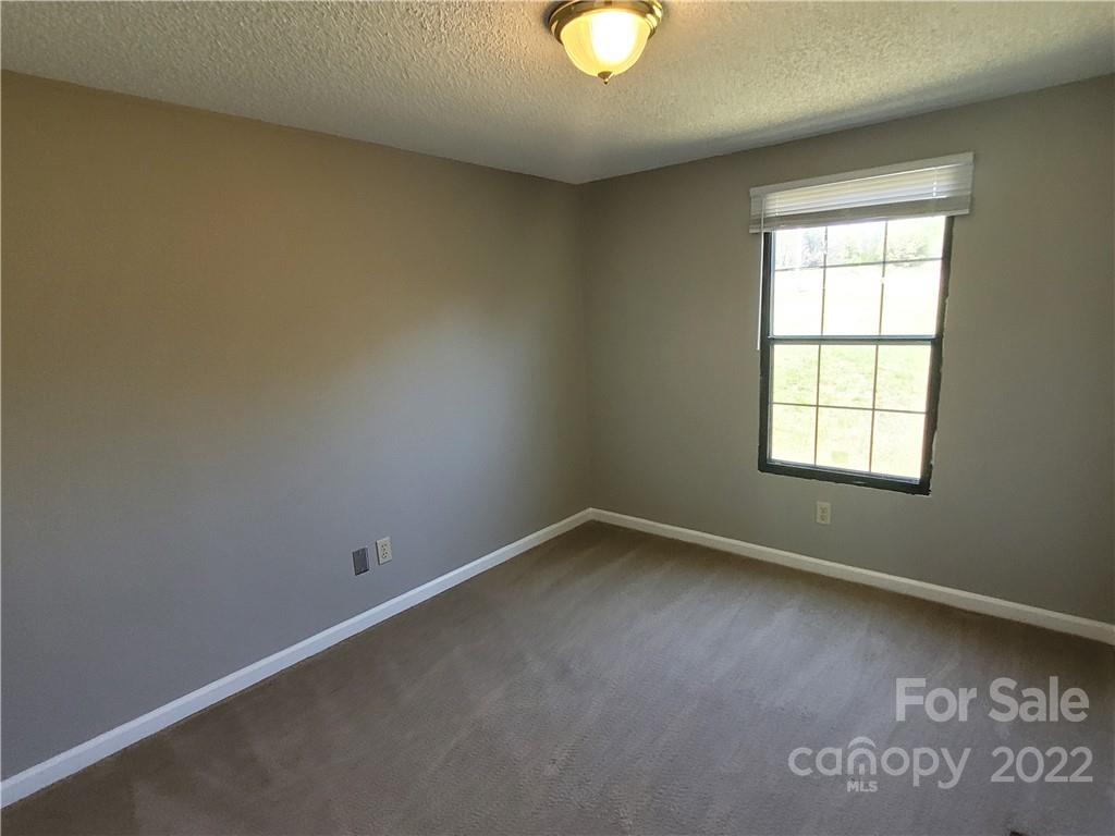 309 Johnson Dairy Road Mooresville, NC 28115 - Photo 14 of 19 an empty room with a window