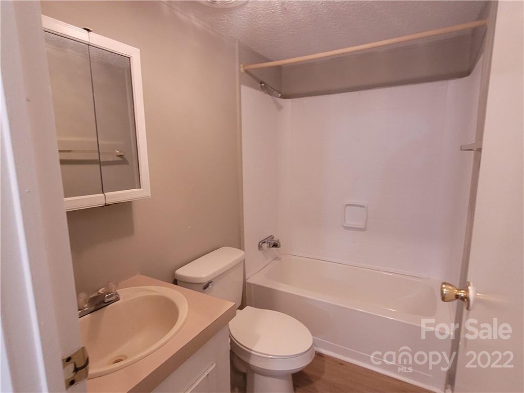 309 Johnson Dairy Road Mooresville, NC 28115 - Photo 15 of 19 a white toilet sitting next to a bath tub