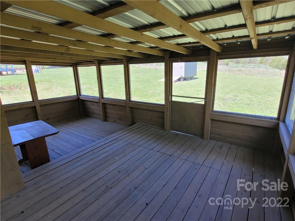 309 Johnson Dairy Road Mooresville, NC 28115 - Photo 16 of 19 an empty room with wooden floor and windows