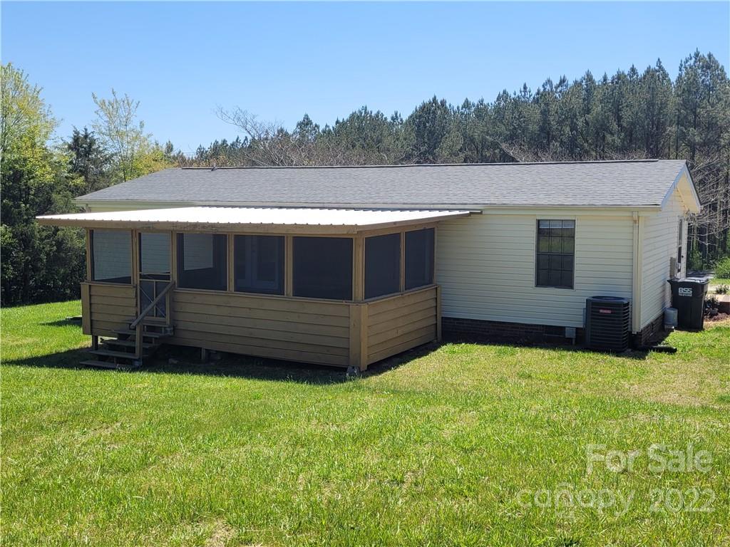 309 Johnson Dairy Road Mooresville, NC 28115 - Photo 18 of 19 a view of a house with a yard and sitting area