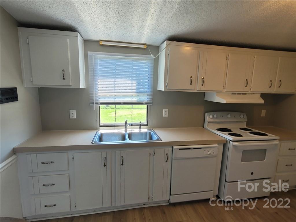 309 Johnson Dairy Road Mooresville, NC 28115 - Photo 4 of 19 a kitchen with appliances cabinets and a sink