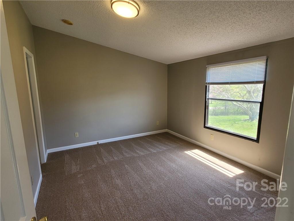 309 Johnson Dairy Road Mooresville, NC 28115 - Photo 9 of 19 an empty room with windows