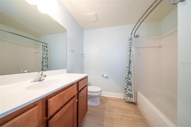 a view of a house with a swimming pool and sitting area