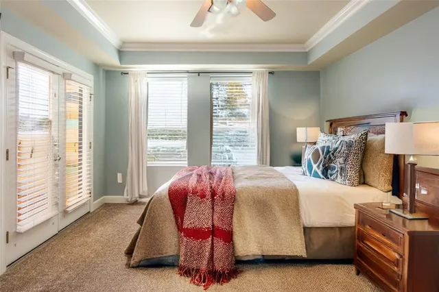 a view of a livingroom with wooden floor and a flat screen tv