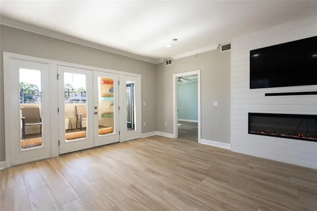 a spacious bathroom with a bathtub sink and mirror