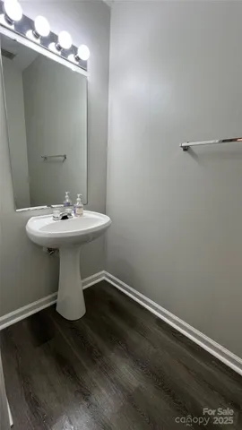 a white sink sitting inside of a bathroom