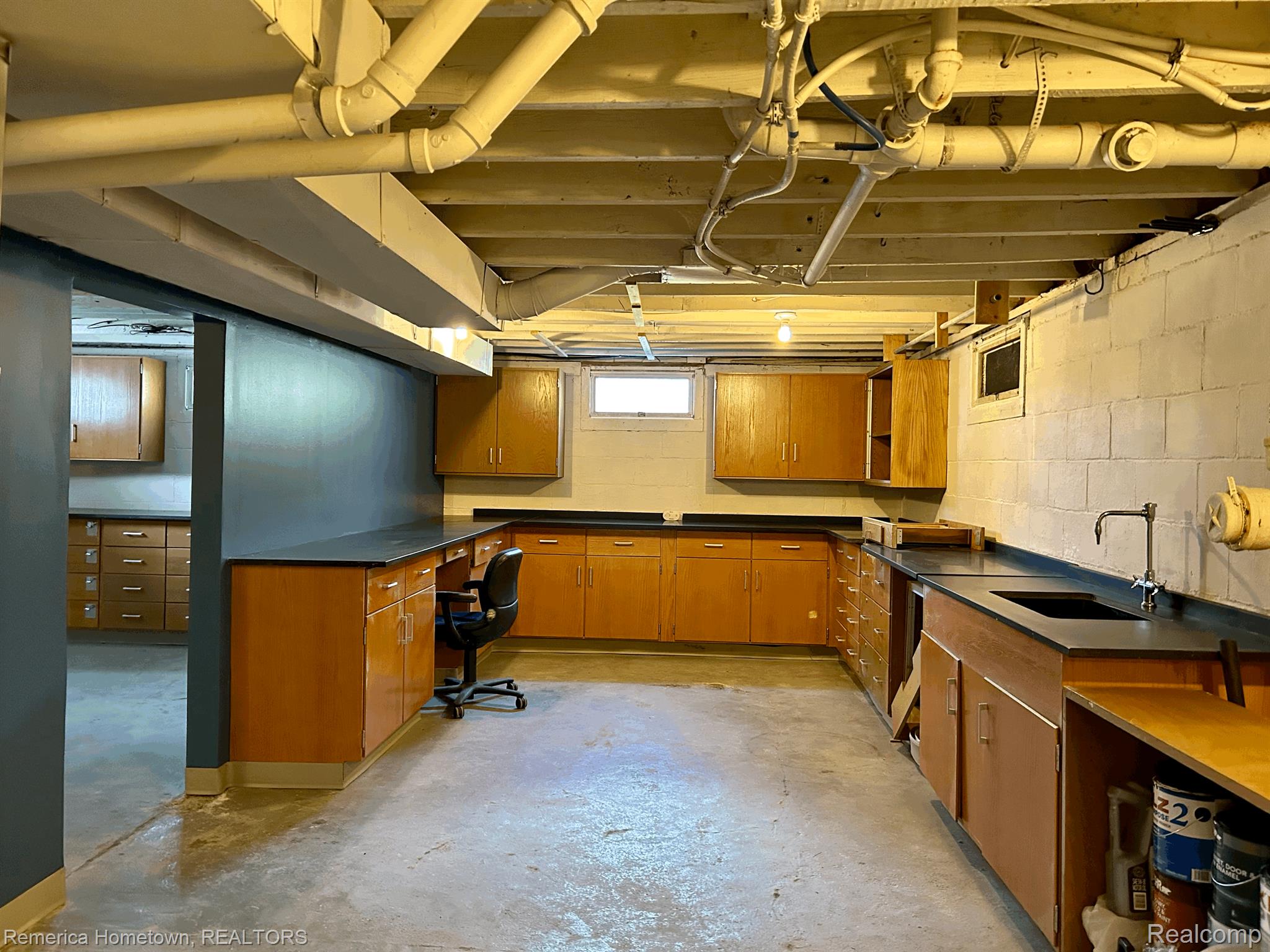 11093 White Lake Road Fenton, MI 48430 - Photo 25 of 37 So much built-in storage in the basement.