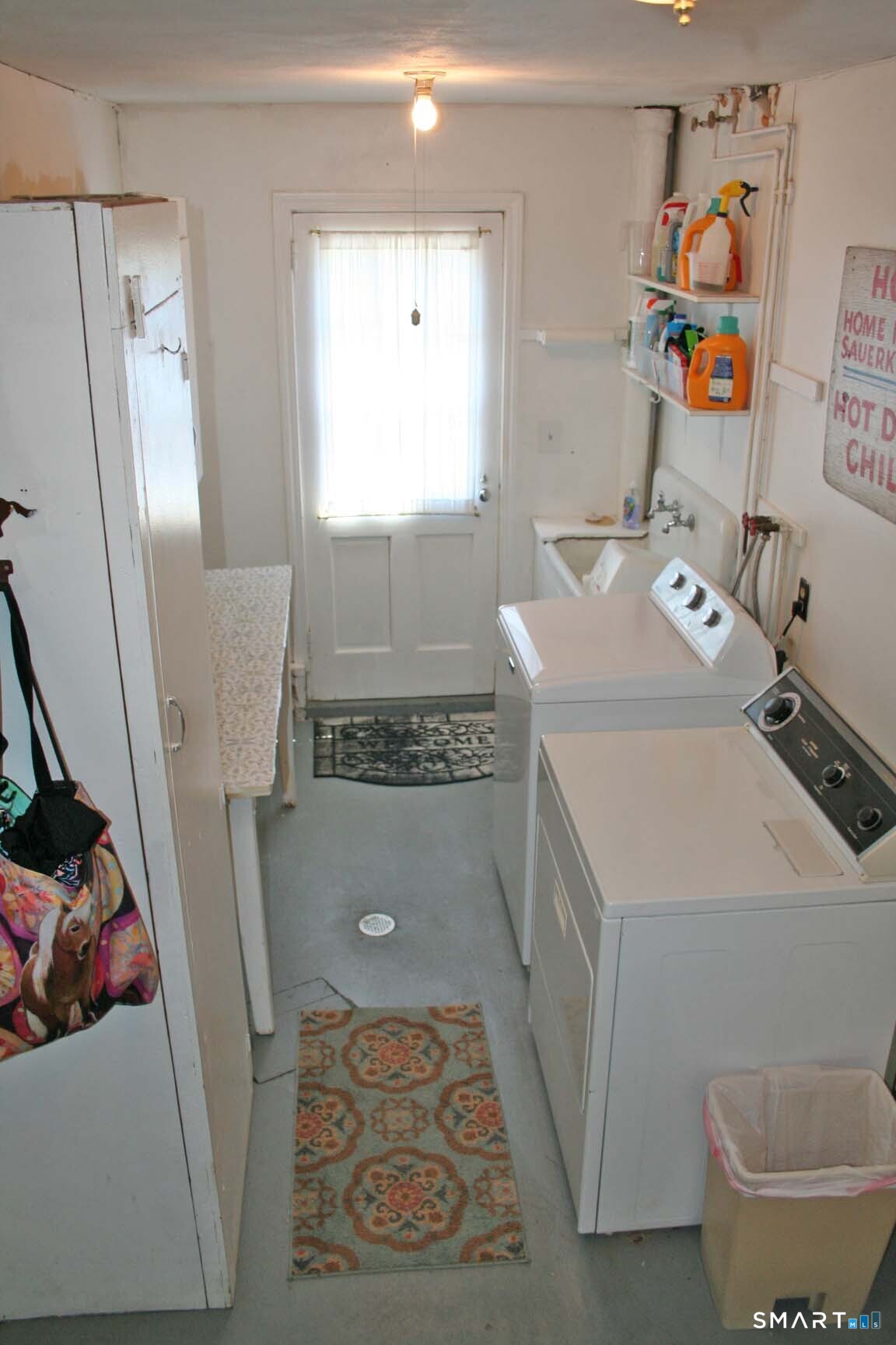 65 Prout Hill Road Middletown, CT 06457 - Photo 24 of 31 Downstairs on the garage level the laundry room is between the garages. A door leads directly outside