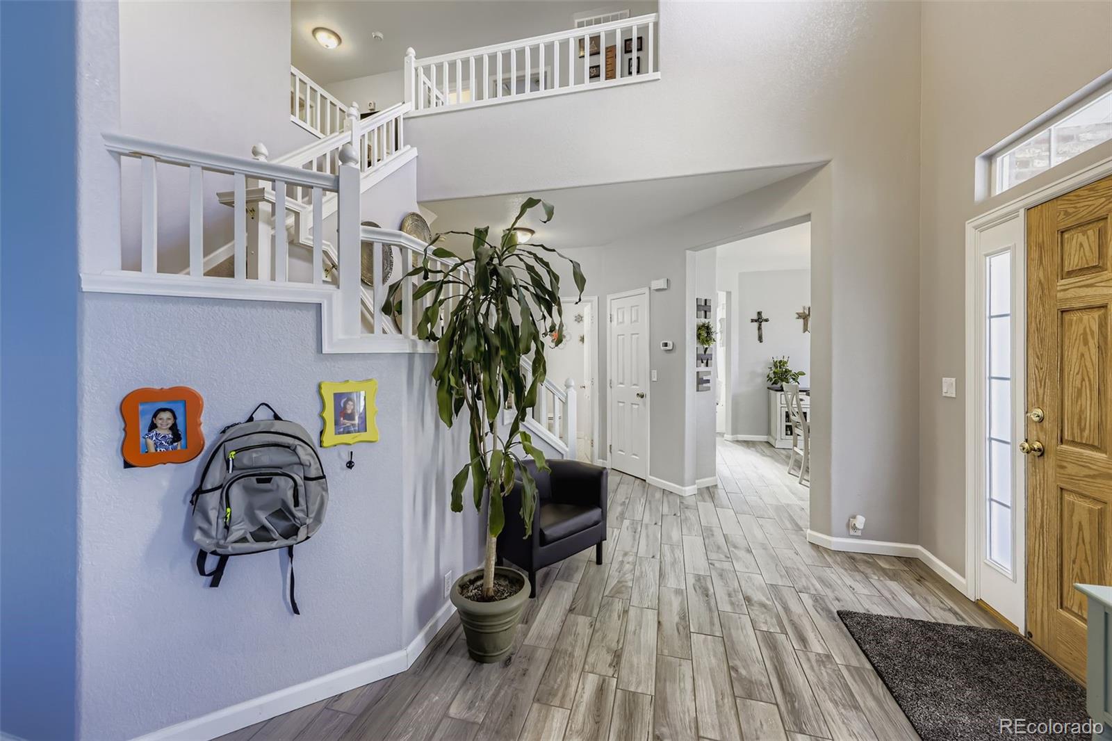11668 Xavier Way Westminster, CO 80031 - Photo 11 of 22 a view of entryway with wooden floor