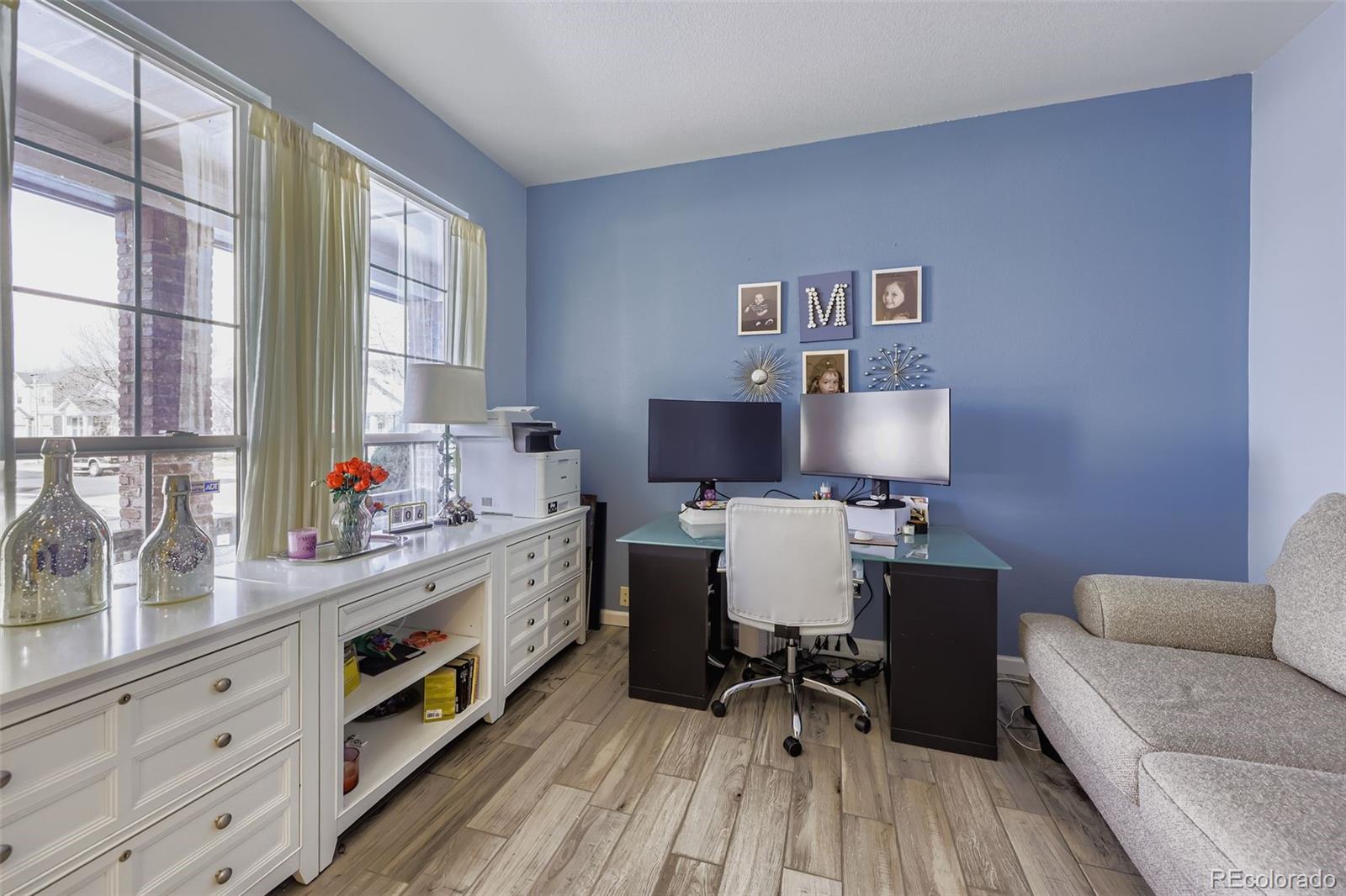 11668 Xavier Way Westminster, CO 80031 - Photo 2 of 22 a workspace with furniture and a window
