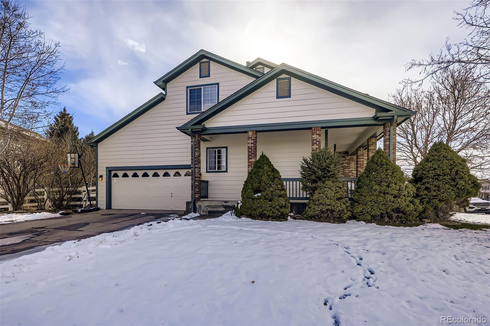11668 Xavier Way Westminster, CO 80031 - Photo 22 of 22 a view of a house with a yard and potted plants