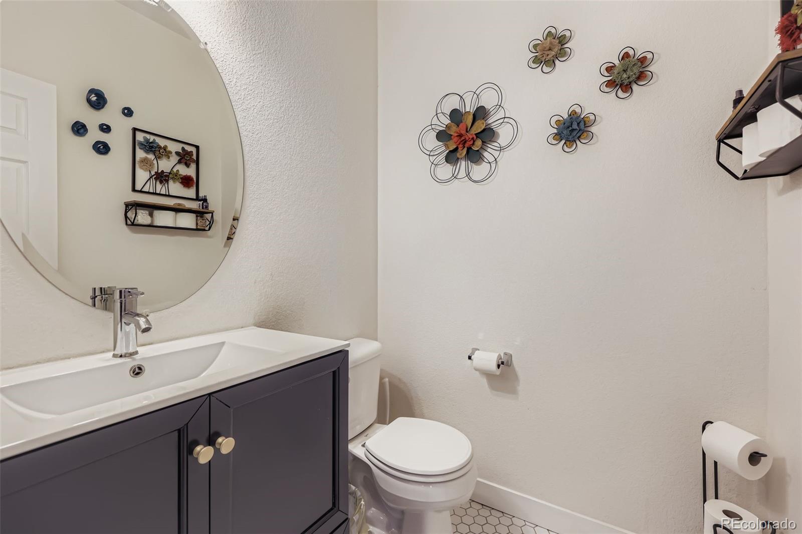 11668 Xavier Way Westminster, CO 80031 - Photo 10 of 22 a bathroom with a sink mirror and toilet