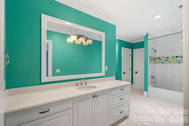 a bathroom with a double vanity sink mirror and shower