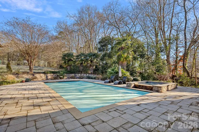 a view of a house with a garage and yard