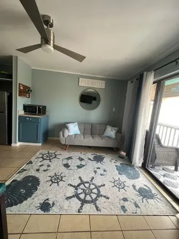 a bedroom with a bed and a tv on the dresser