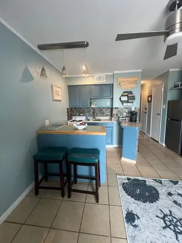 a bathroom with a toilet and a shower curtain
