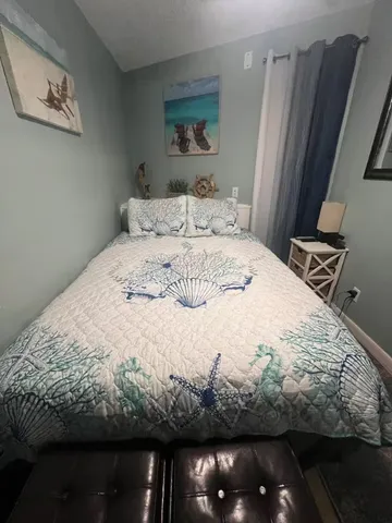 a view of a hallway with furniture