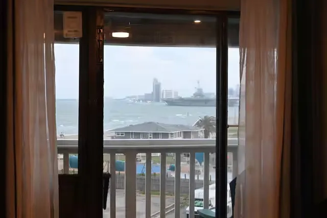 a view of a glass door and a porch