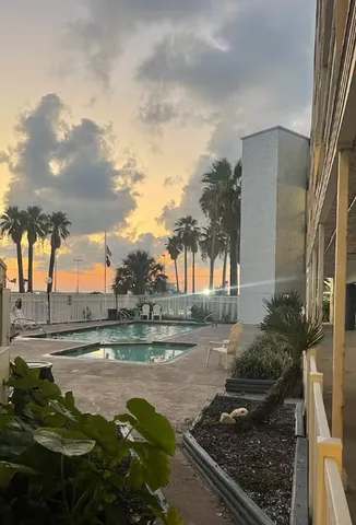 a view of a gym and trees in the background