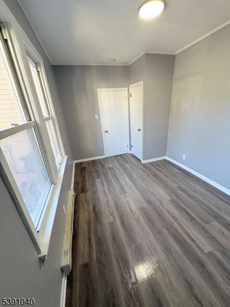 37 Mercer Street, Unit 1 Wallington, NJ 07057 - Photo 6 of 12 a view of an empty room and wooden floor