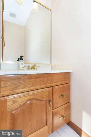 a close view of bathroom sink and mirror