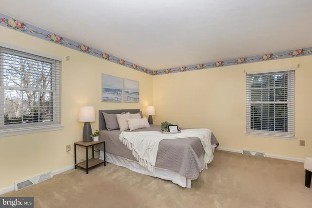 a bedroom with a bed and a night stand