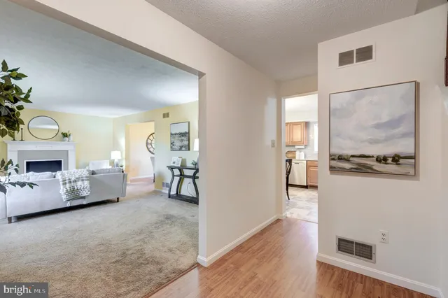 a view of a livingroom with furniture and a fireplace