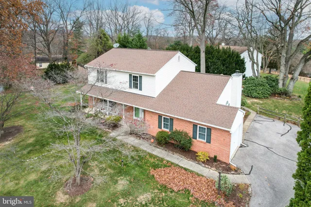 a view of a house with a yard porch and sitting area