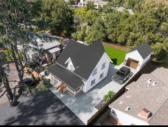 an aerial view of a house with a yard