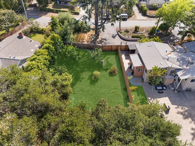 an aerial view of residential house with outdoor space