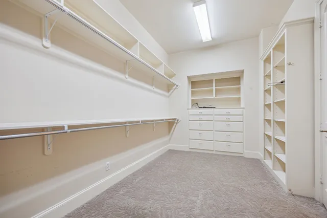 a spacious bathroom with a tub sink and a shower