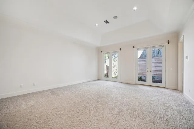 a view of a livingroom with wooden floor and a window
