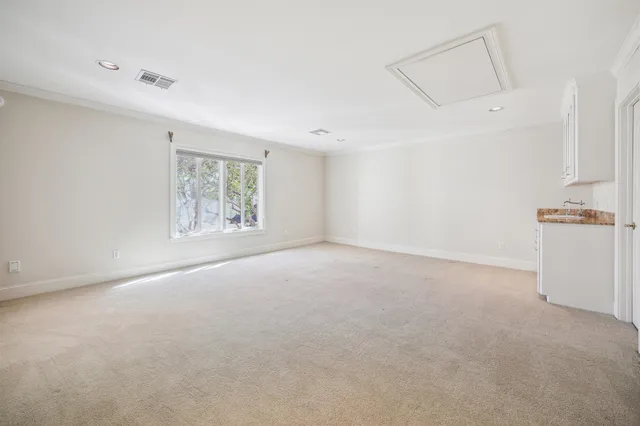 a view of empty room with windows