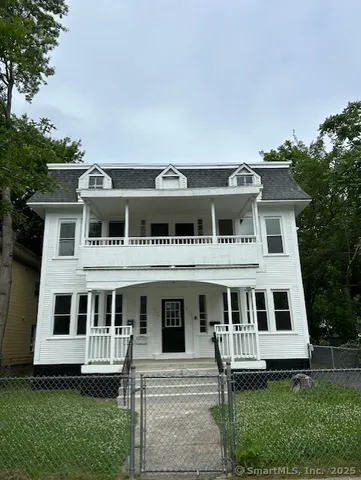 a view of house with yard