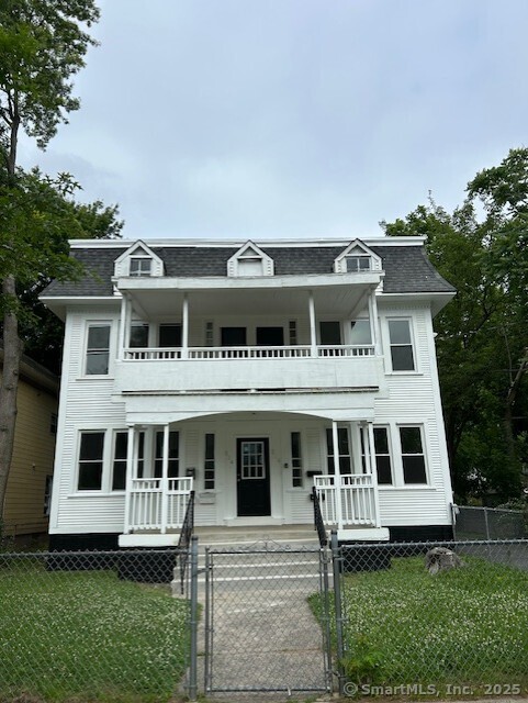 a view of house with yard