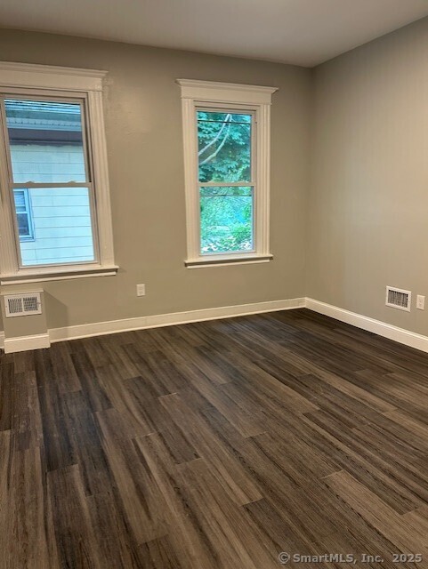 514 Winthrop Avenue New Haven, CT 06511 - Photo 3 of 17 a view of an empty room with wooden floor and a window