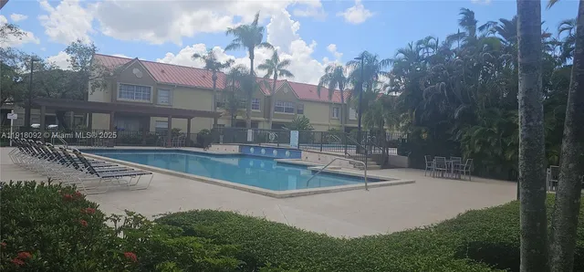 a view of swimming pool with a bench