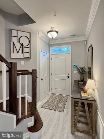 a metallic refrigerator freezer sitting in a kitchen