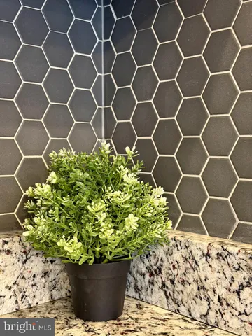 a bed room with furniture and a flat screen tv