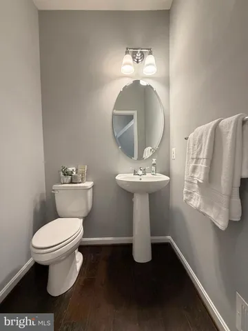 a balcony with furniture and wooden floor
