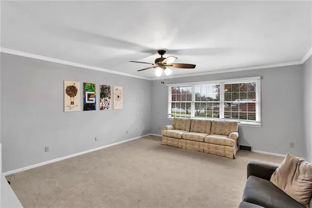 a living room with furniture and white walls