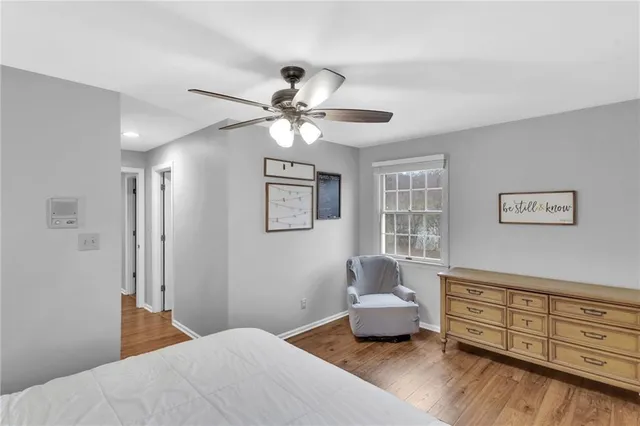 a bedroom with a bed and furniture