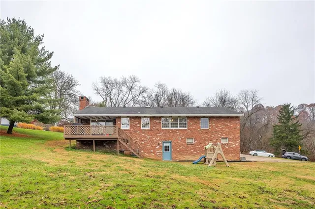 a view of a swimming pool with a yard
