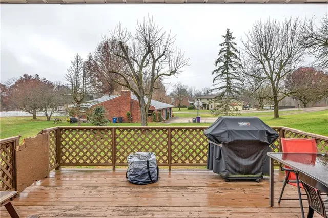 a view of outdoor space with deck and yard